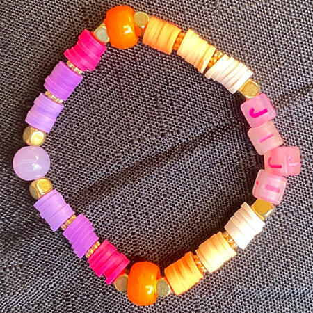 Bracelet in orange, gold, cream, yellow, purple and pink, inspired by Jiji from DanDaDan.